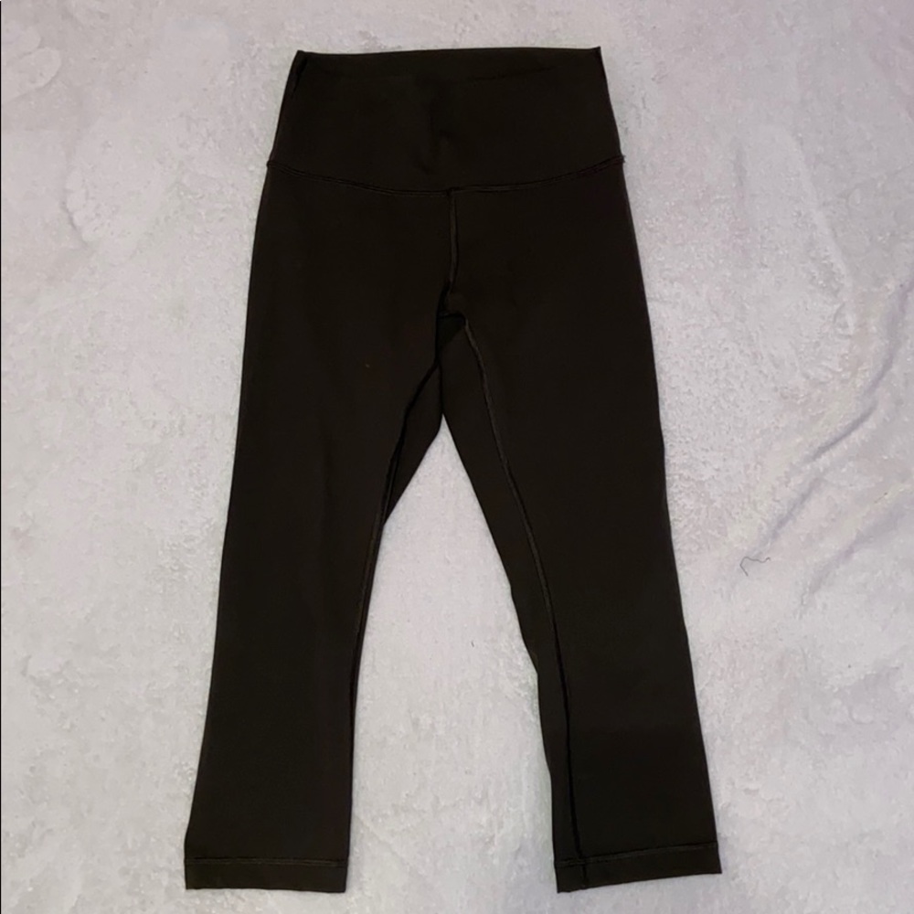 Dark Green Lululemon mid-calved leggings.